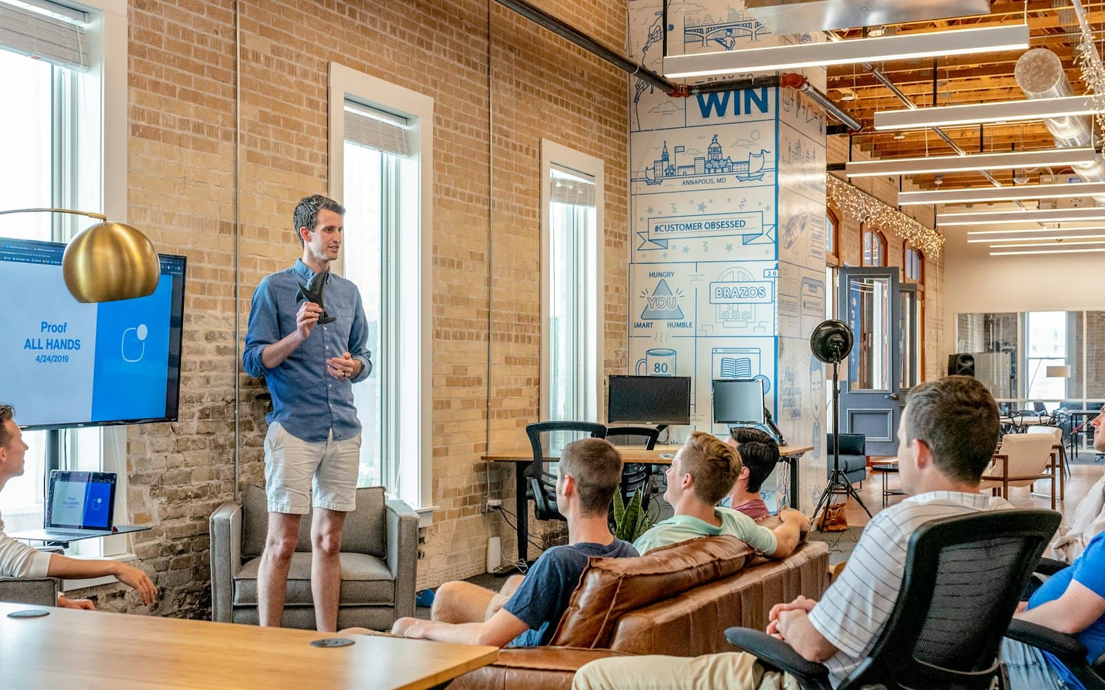 A standing meeting in an office — keep the WhatsApp pipe you already pay for; put the team on one conversation OS.