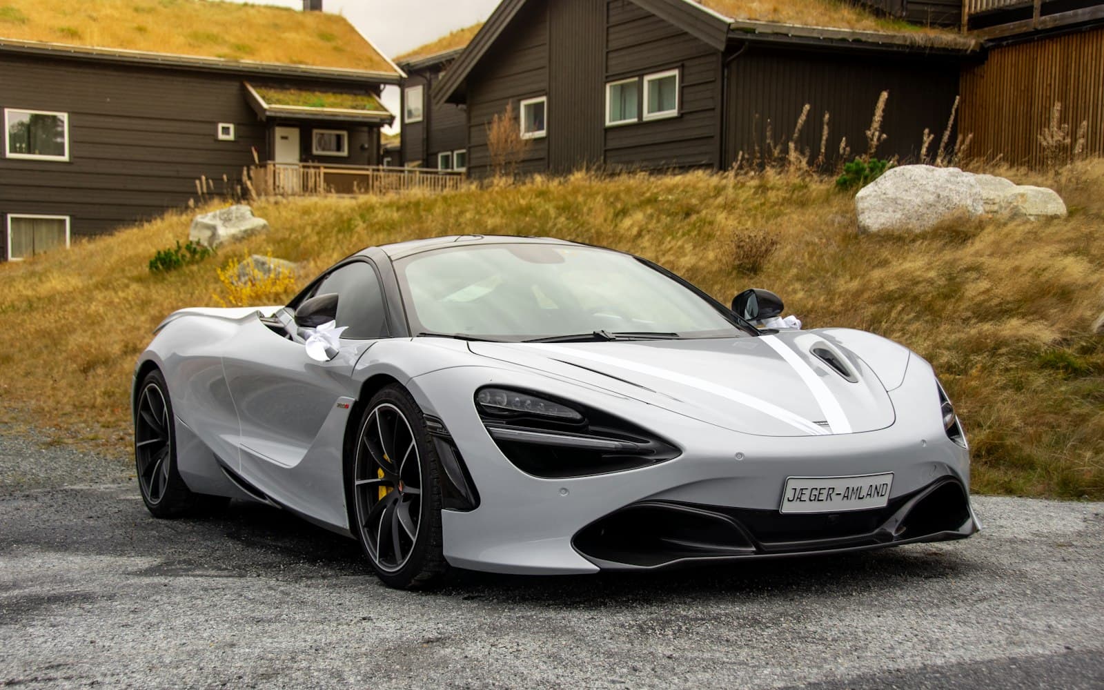 A white car in daylight — stock status has to match the message you just sent, in Pune or in Dubai.