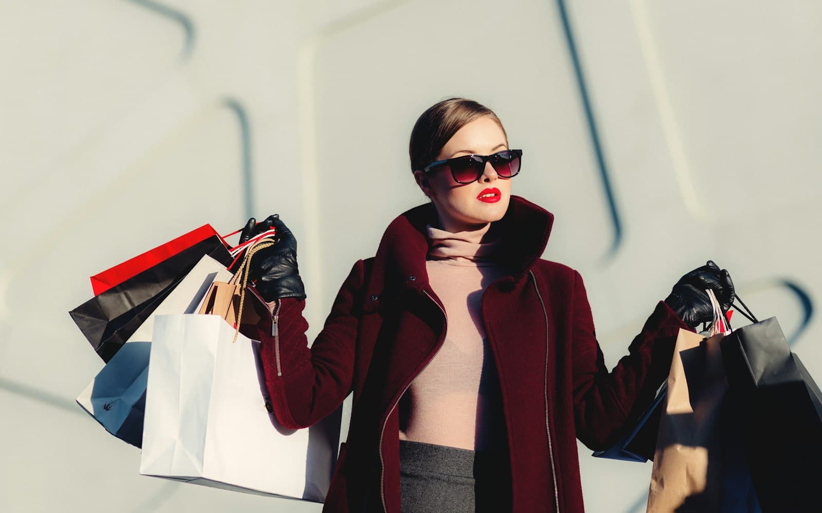 A shopper on a city street with bags — the website cart and the store hold are the same person, or you will double-message them.