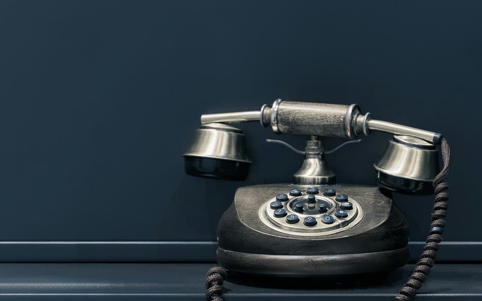 A desk telephone — we log the 1:1 call. We do not become the office PBX.