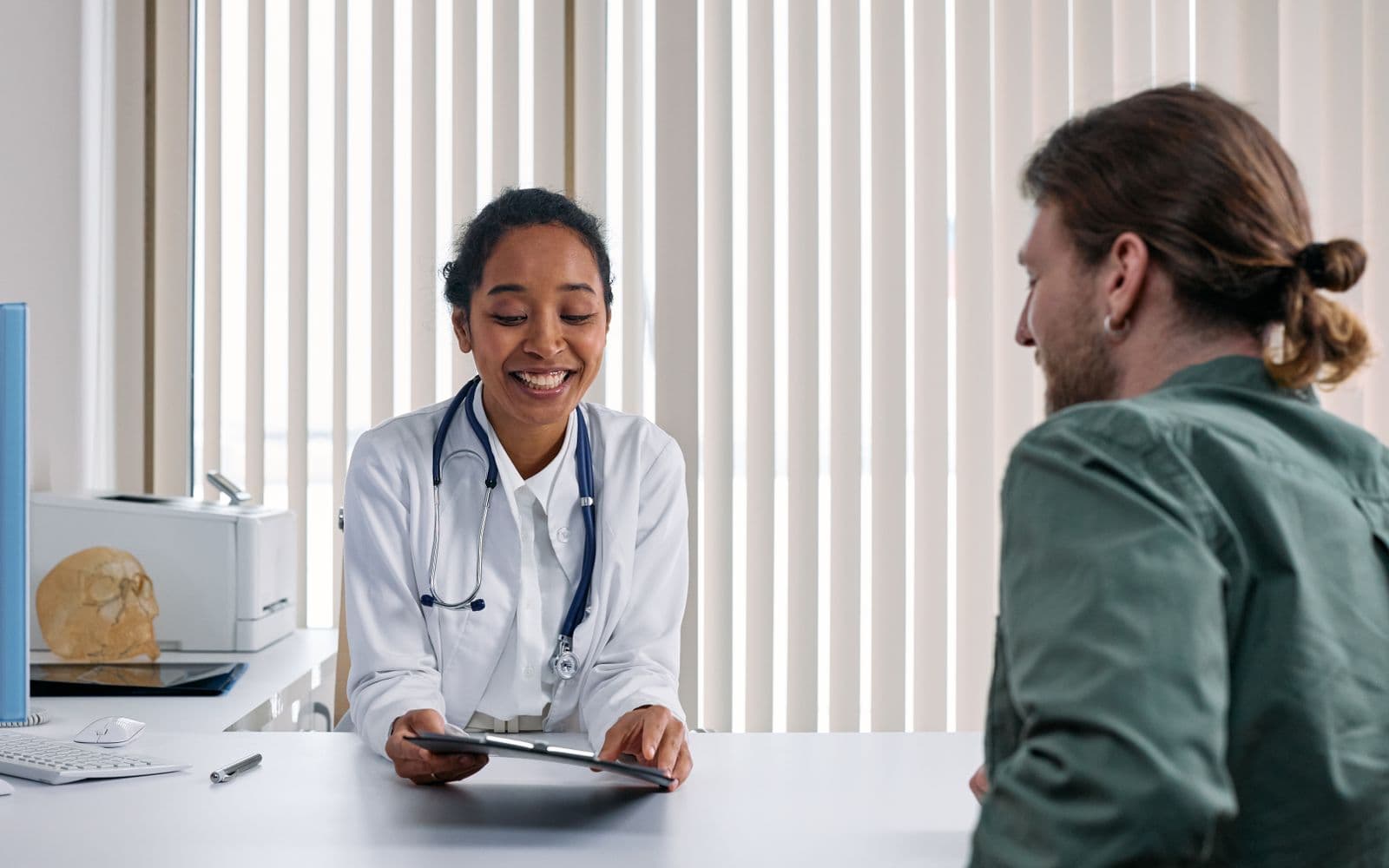A consult at the desk — confirm the slot and the follow-up date; do not paste a diagnosis into the thread.