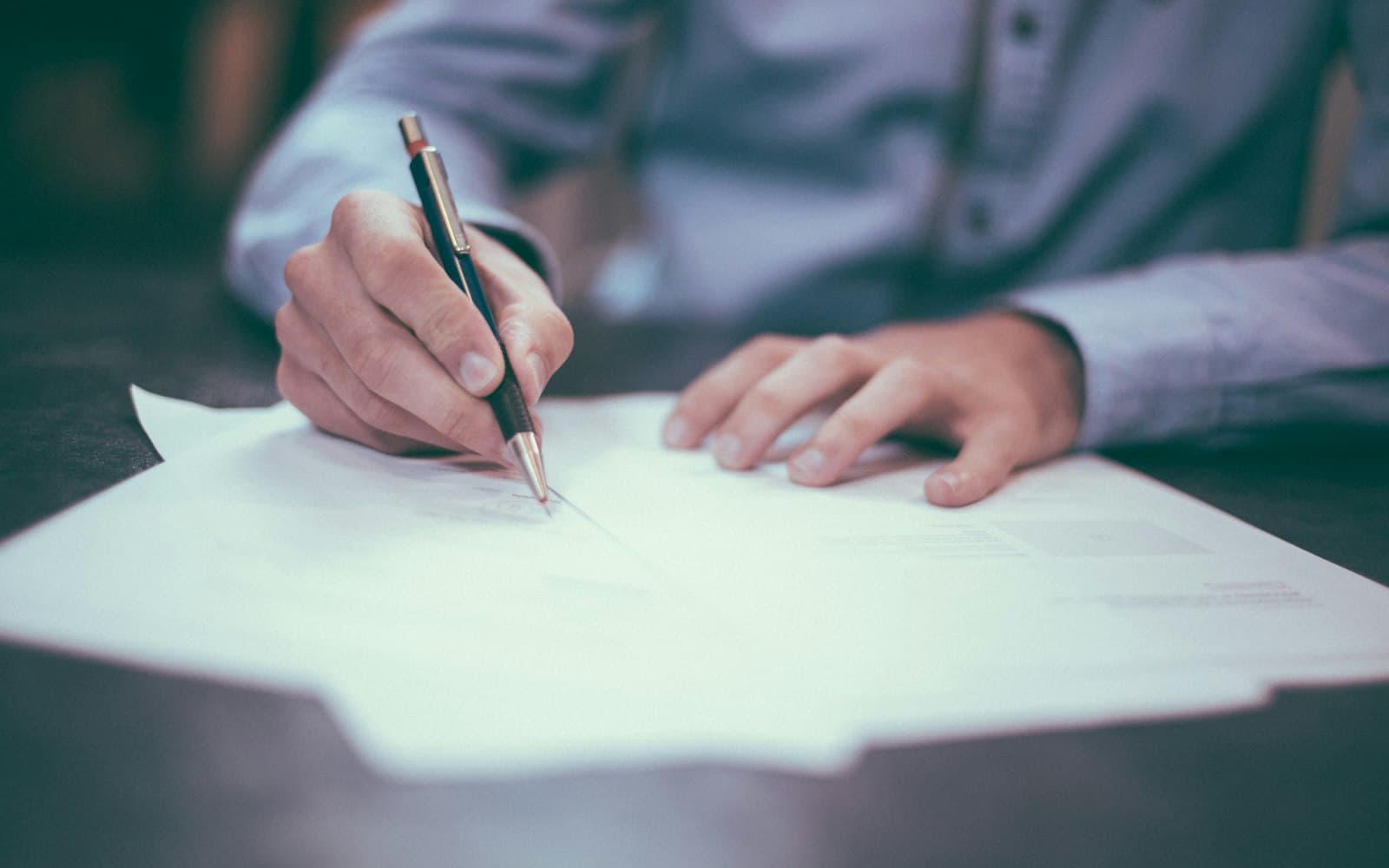 Signing a form — issued is a pipeline stage, not a reason to store a full account number.