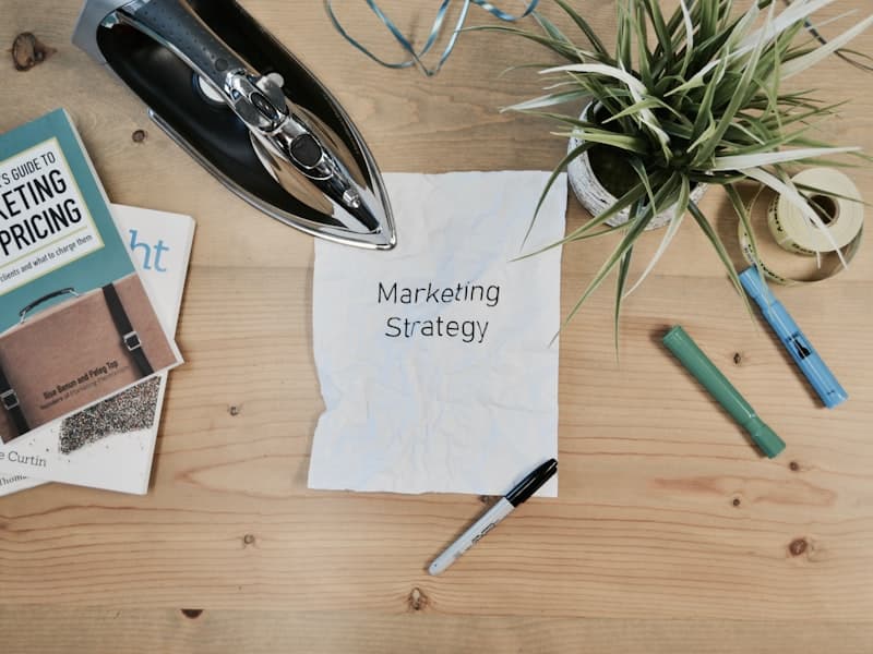 A handwritten note reading "Marketing Strategy" surrounded by planning materials
